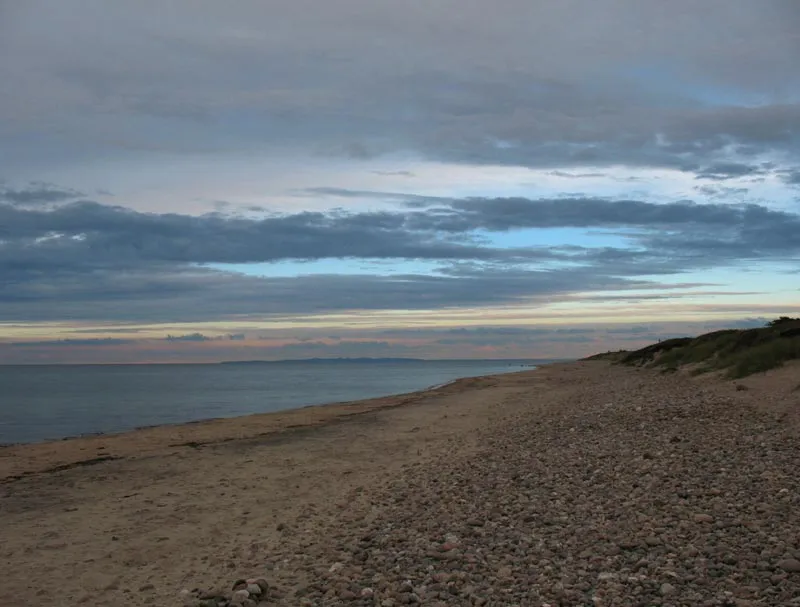 To the right - The beach to the right. A nice sky.