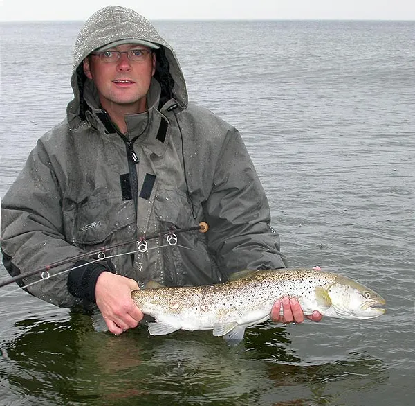Rain - I use my jackets first and foremost to keep out rain like here. This is a Scierra Aquatex. Notice the location of the pockets... far too low! There is plenty space above them. Why not move them up? That would make them stay dry when I am wading like this - which is not even particularly deep.
